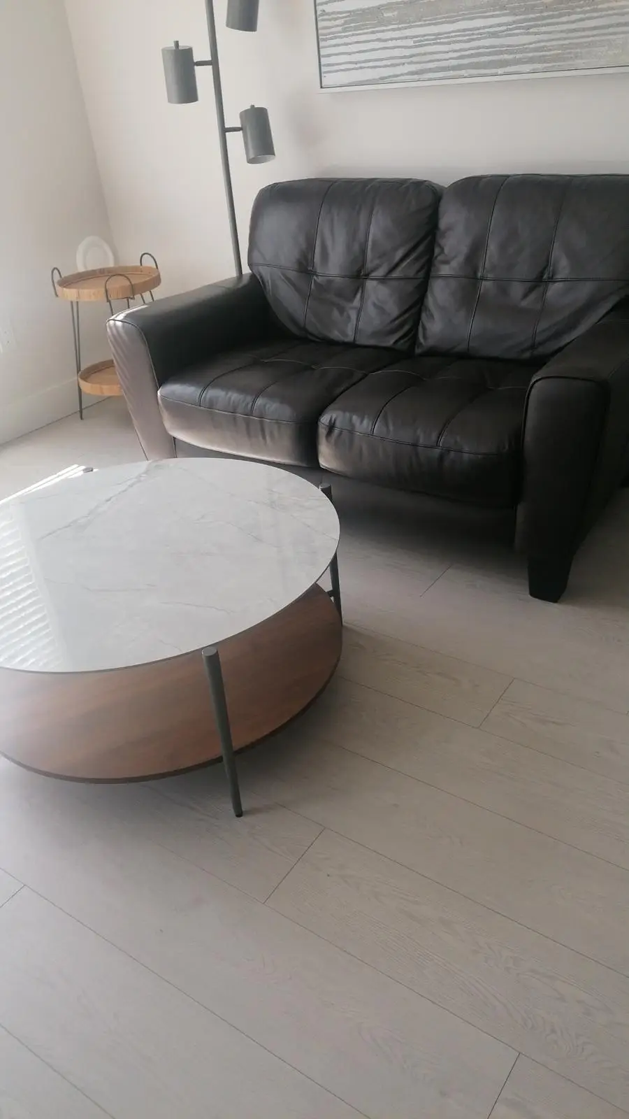 Black leather sofa in a living room