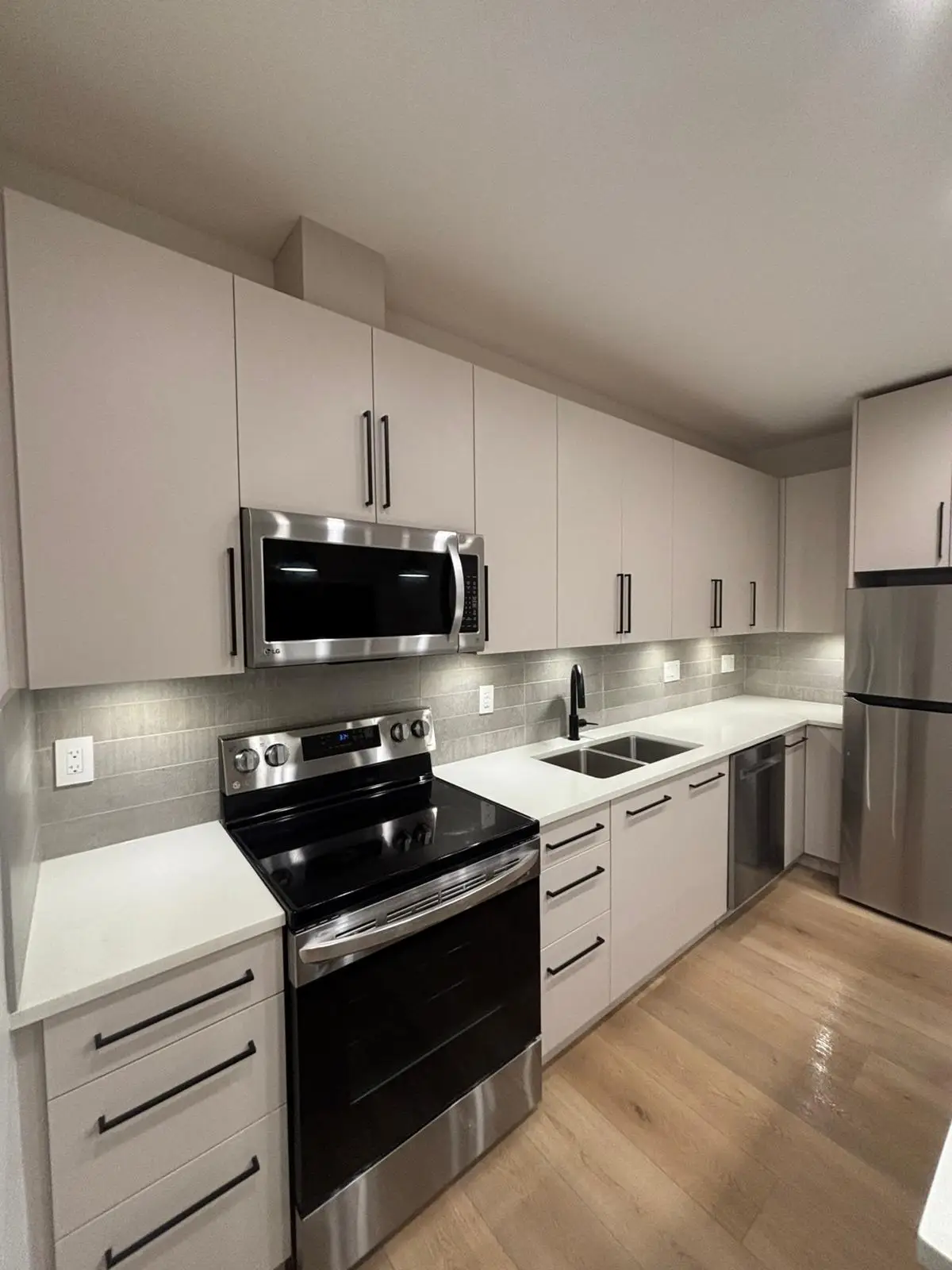 Kitchen with white cabinets and stainless steel appliances
